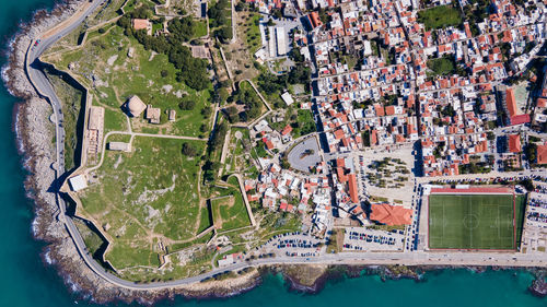 High angle view of swimming pool by river in city