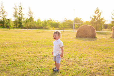 Boy standing on field