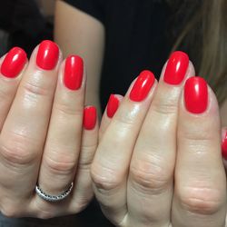 Close-up of woman hand with red chili peppers