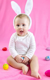 Portrait of cute baby boy playing with toy