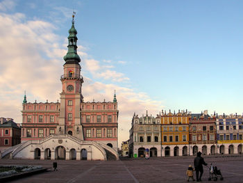 Buildings in town against sky