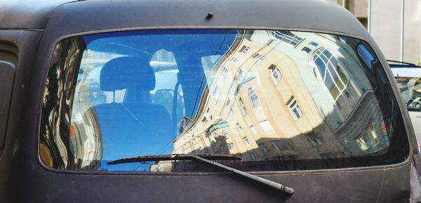 Reflection of car on window