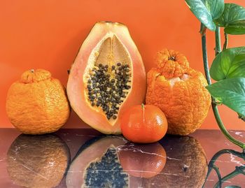 Close-up of orange fruits on table