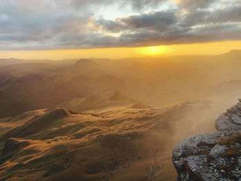 Aerial view of landscape against sky during sunset