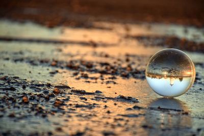 Close-up of crystal ball on water