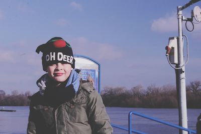 Portrait of man wearing sunglasses against sky during winter