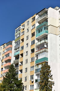 Typical facade of concrete panel building. post soviet flat of blocks