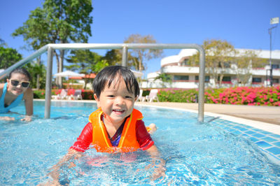 Portrait of young woman in swimming pool