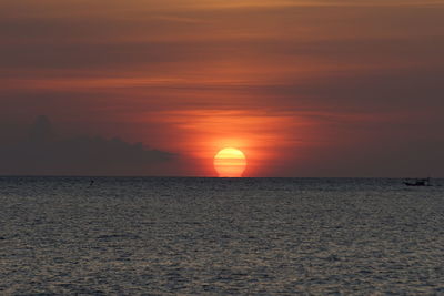 Scenic view of sea against romantic sky at sunset