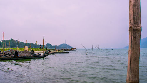 Boats sailing in sea against sky