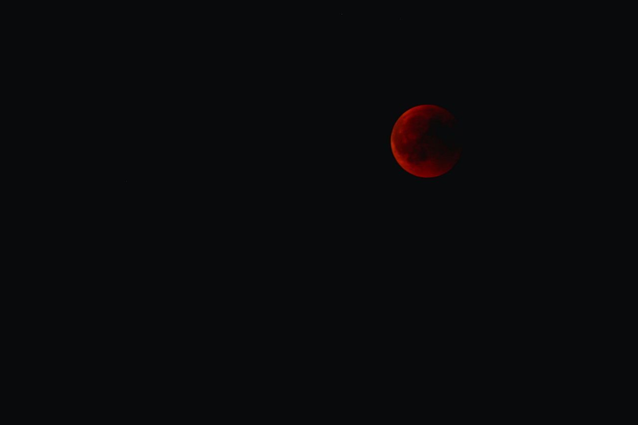 LOW ANGLE VIEW OF MOON AGAINST SKY