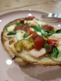 Close-up of pizza served on table