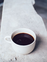 High angle view of coffee cup on table