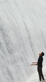 Man enjoying waterfall