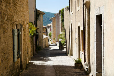 Narrow alley amidst buildings in town