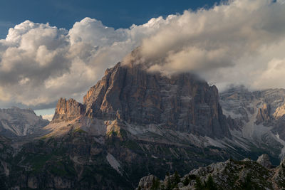 Panoramic view of smoking mountain range at sunset 