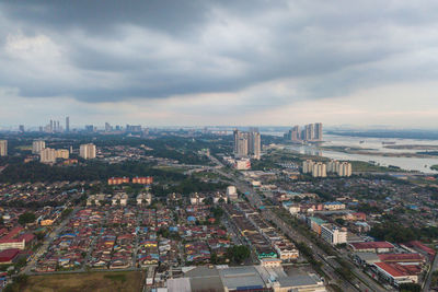 High angle view of city buildings against sky