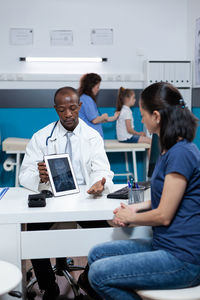Doctor and patient having conversation at clinic