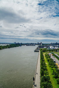 High angle view of river and city against sky