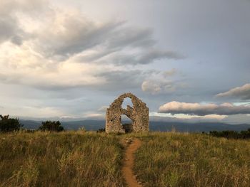 Castle on field against sky