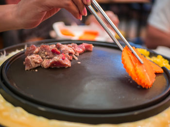 Close-up of person preparing food