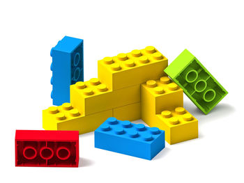 Close-up of yellow toys against white background