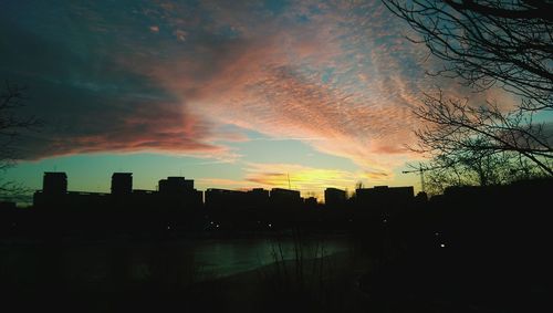 Silhouette of city at sunset