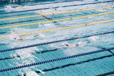 High angle view of people swimming in pool