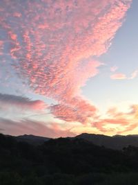 Scenic view of silhouette mountains against sky at sunset