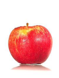 Close-up of red fruit over white background