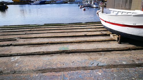 Boats moored at harbor