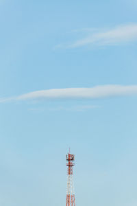 Low angle view of communications tower against sky