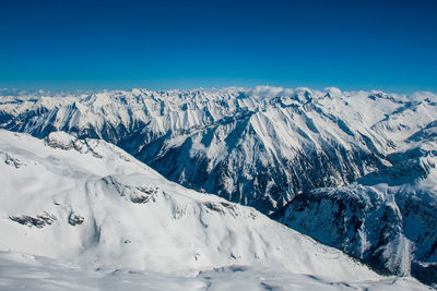 Scenic view of snowcapped mountains against blue sky austria glaciar 