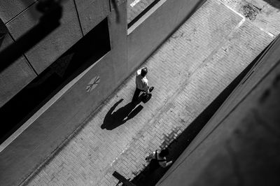 High angle view of man walking in alley