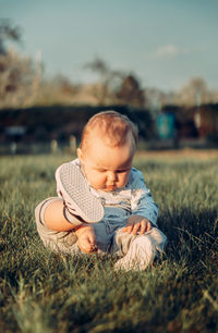 Cute baby girl on field