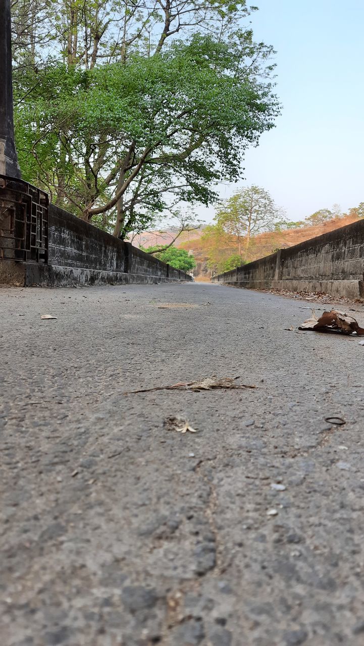 SURFACE LEVEL OF FOOTPATH AGAINST SKY