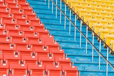 Empty chairs against blue sky