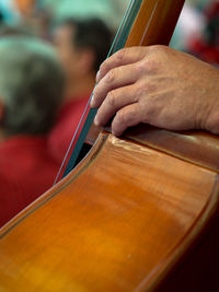 Cropped hand playing cello