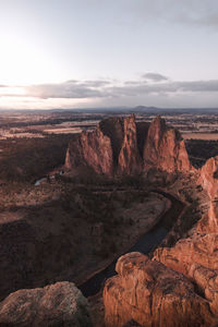 Rock formations on landscape against sky