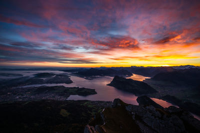 Scenic view of mountains against sky at sunset