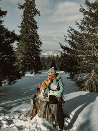 People on snow covered land during winter