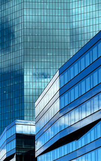 Low angle view of modern buildings against sky