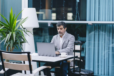 Man working on table in office