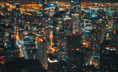 Aerial view of illuminated city at night