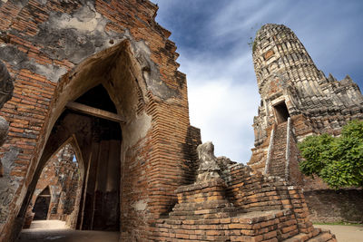 Low angle view of old ruin building against sky