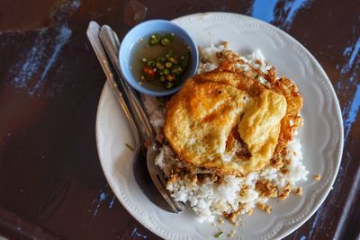 High angle view of rice in plate on table