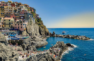 Panoramic view of sea against clear blue sky