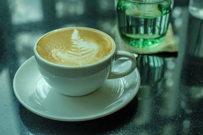 Close-up of coffee cup on table