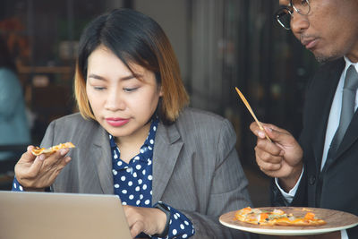 Midsection of a woman eating food