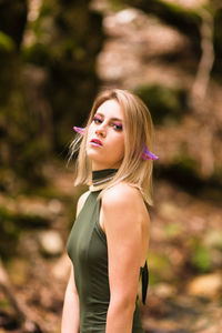 Portrait of beautiful woman standing outdoors